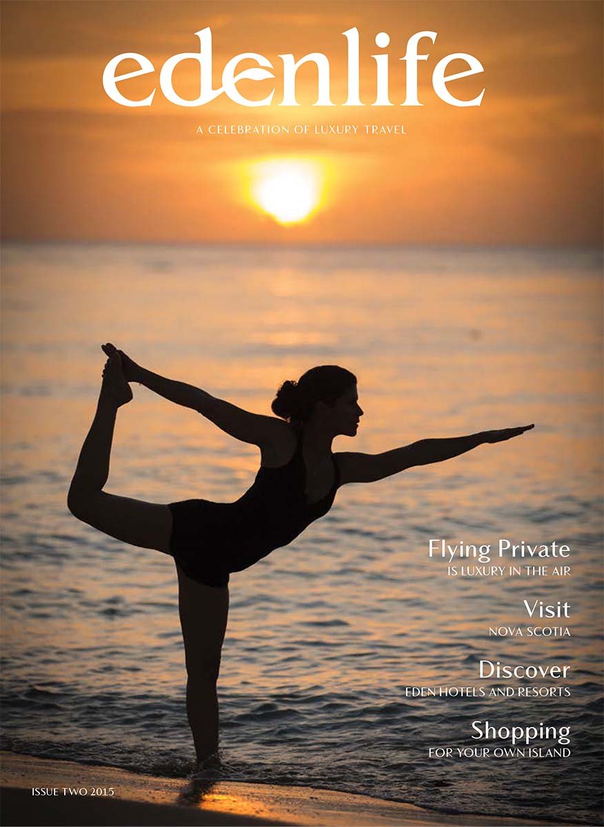 Cover for travel magazine of yoga on the beach in the Caribbean