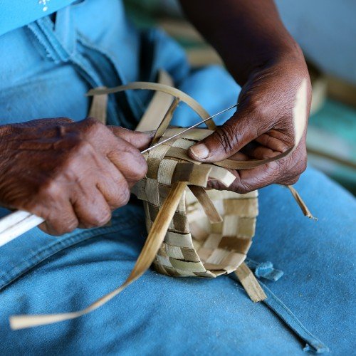 making baskets in market