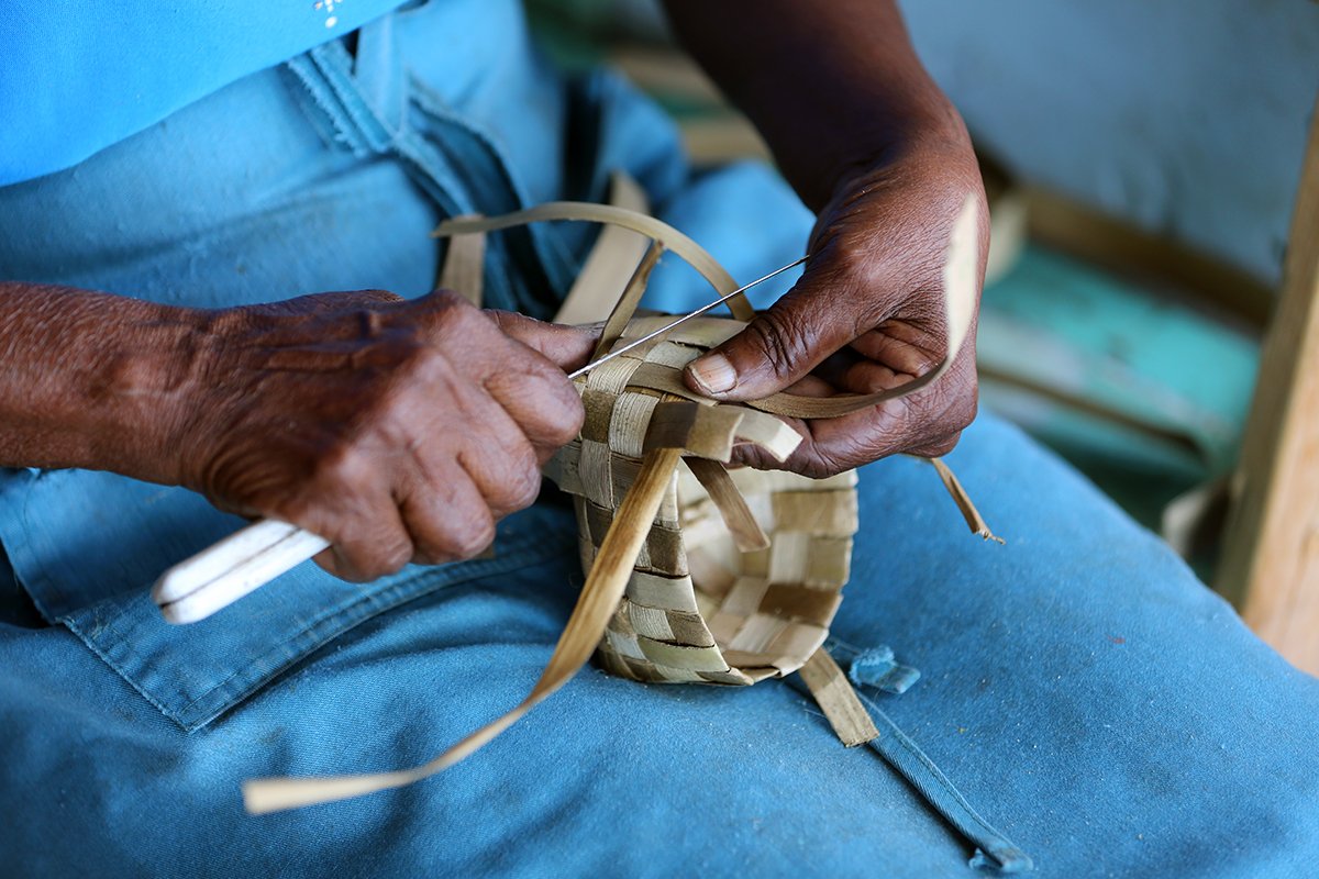 making baskets in market